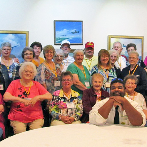 People posing at an art gallery